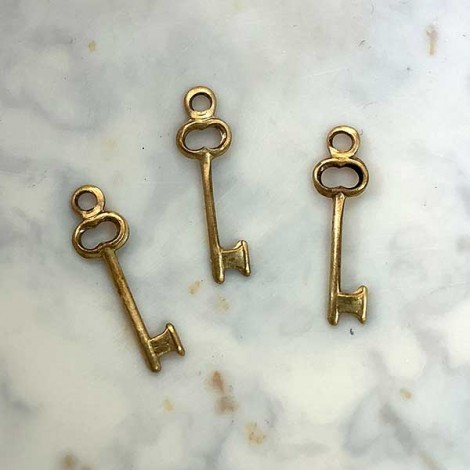 8mm Teeny Key Raw Brass Charms - Pack of 10 8mm Teeny Key Raw Brass Charms - Pack of 10