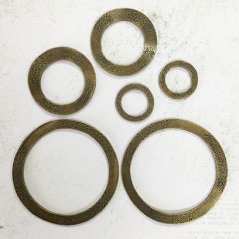 Antique Gold 20mm / 35mm / 54mm double-sided textured wavy donut rings. Pkg of 6. 