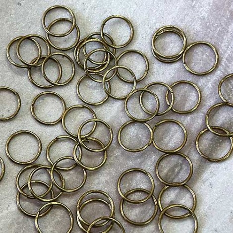 6mm OD 24ga Open Vintage Raw Brass Round Jumprings - Pack of 100 6mm OD 24ga Open Vintage Raw Brass Round Jumprings - Pack of 100