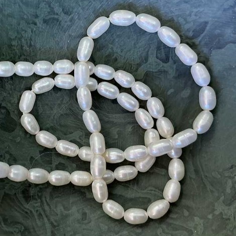 4-4.5mm White Cultured Rice Pearls - Per strand 4-4.5mm White Cultured Rice Pearls - Per strand