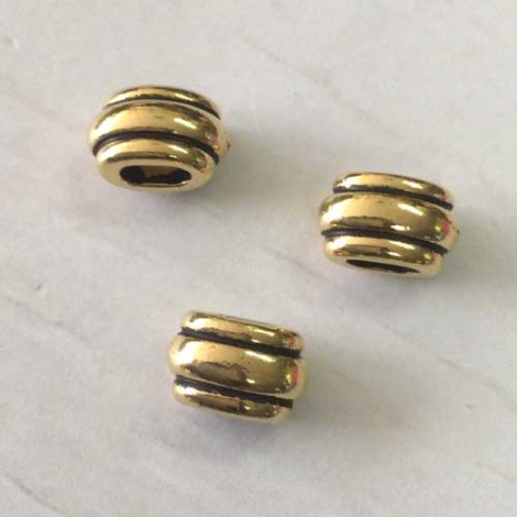 6x9mm (4x2mm ID) TierraCast Deco Barrel or Crimp Beads for 2mm cord - Antique Gold
